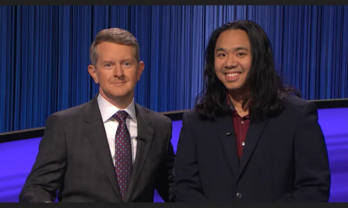  Lloyd Sy and Jeopardy! host Ken Jennings posing against a blue backdrop