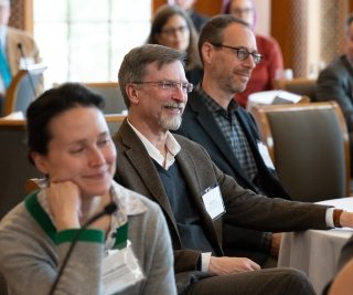 FAS Faculty listen to a speaker