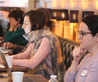 Faculty writing during a retreat