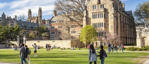 students walking across Yale campus