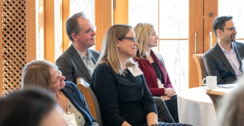 FAS Faculty listen to a speaker