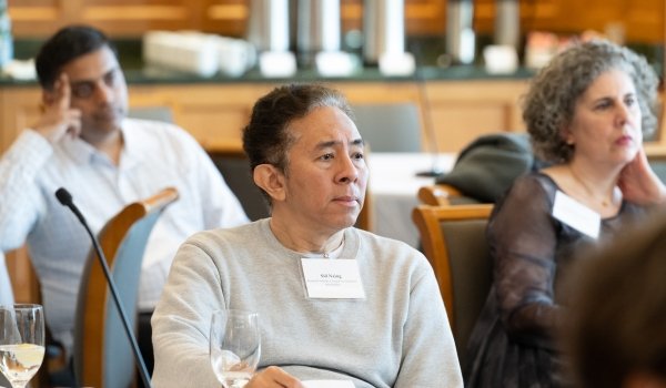 FAS Faculty listen to a speaker