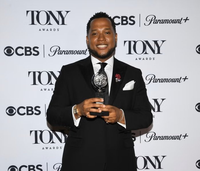Branden Jacobs-Jenkins poses with the Tony award he won on June 8, 2025, for his play "Purpose." Photo courtesy: Evan Agostini / AP