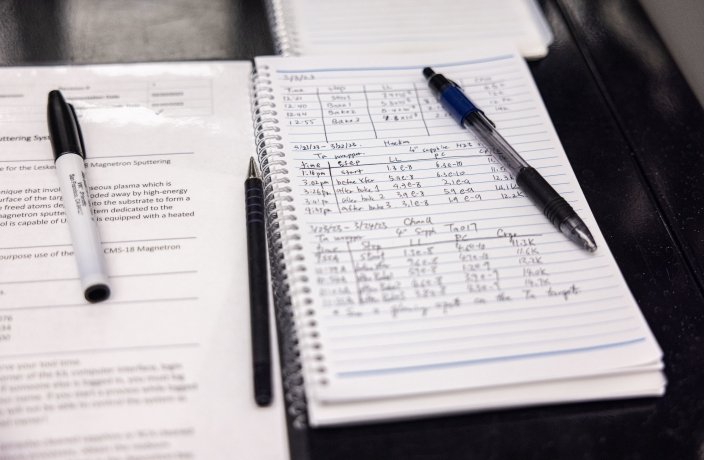 Research notes written down with on a pad of paper