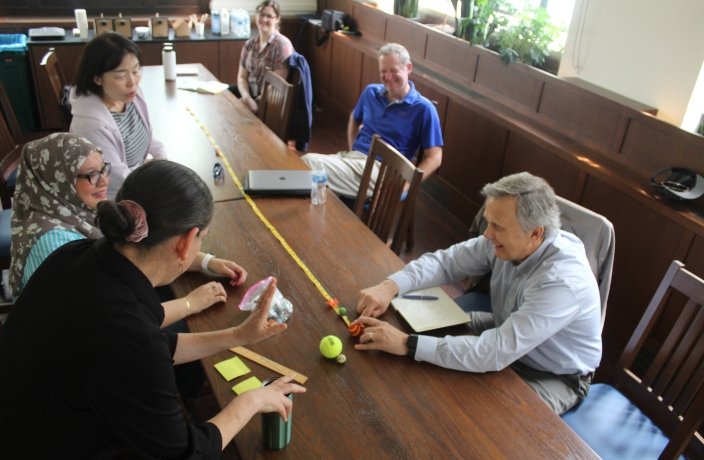 Faculty in a classroom learning from a colleague