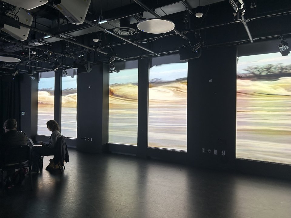 A video of “pororoca,” the collision between the Atlantic Ocean and the Amazon River, playing as one of Suttor’s faculty participants experiments with AI-generated music inspired by the natural phenomenon. Photo credit: Michaela Herrmann.