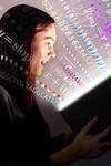 Picture of a woman opening a book in awe, from which light, mathematical equations, numbers, and words spring forward. 