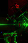 Green lasers coming out and bouncing on machinery