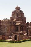 Temples made of red stone with ellaborate inscriptions on the outfacing walls. 