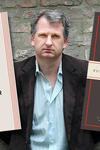 Timothy Snyder with his books On Tyranny and The Road to Unfreedom